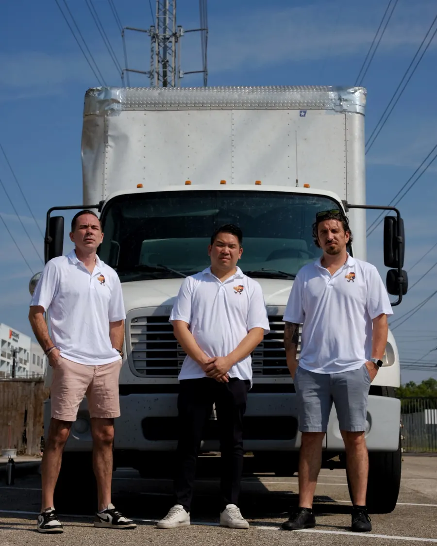 Stack Haus Movers team standing in front of their truck