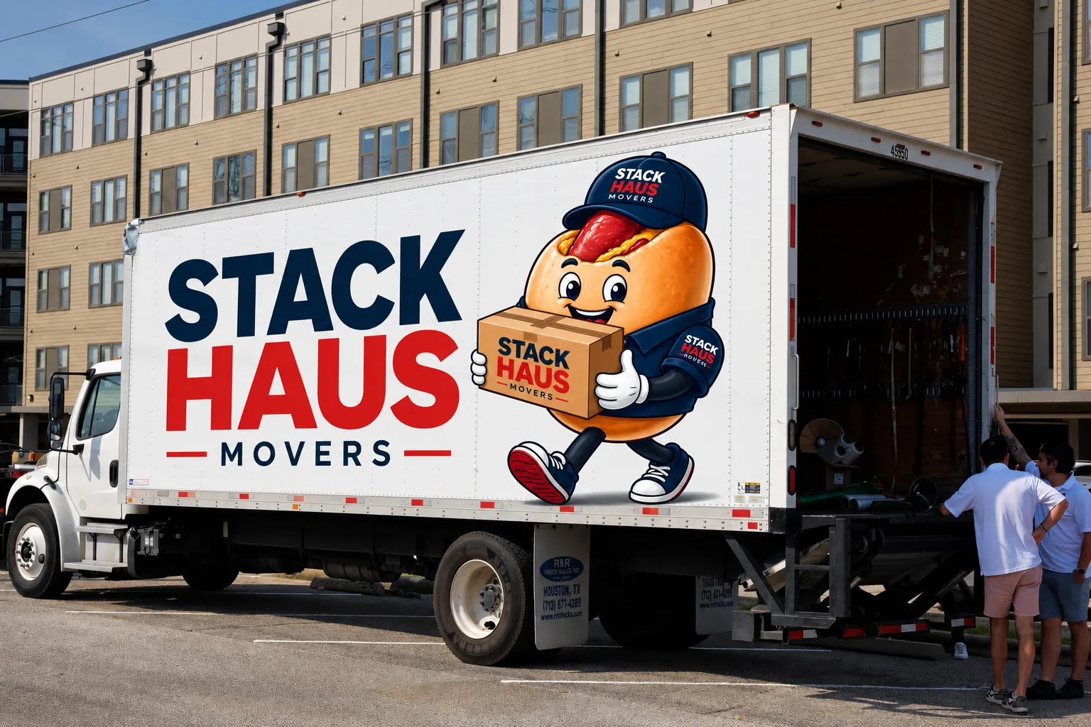 Stack Haus movers loading the back of their branded box truck